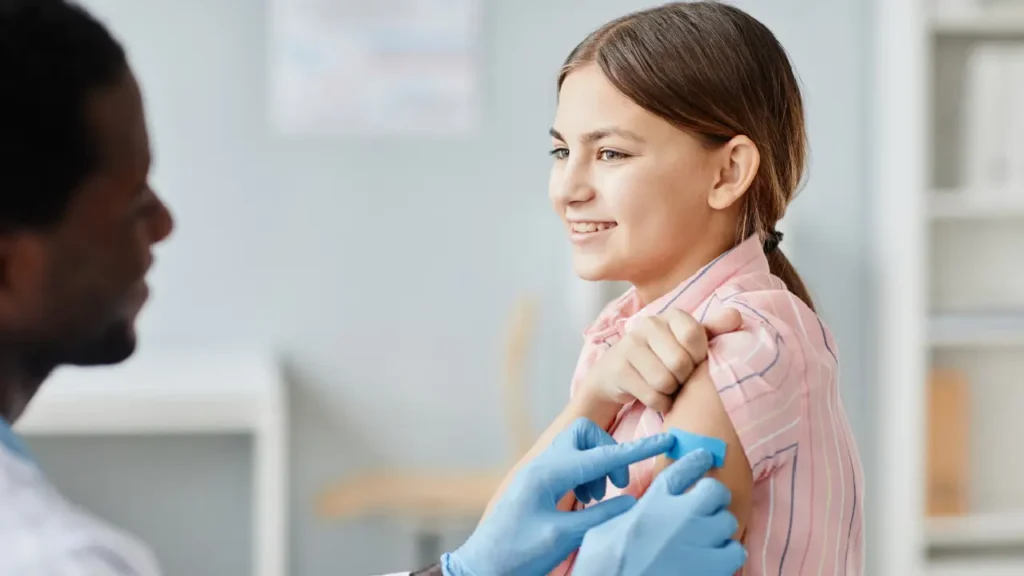 Child receiving a vaccine from a pediatrician at a clinic in Katy, TX, highlighting childhood immunizations and pediatric care