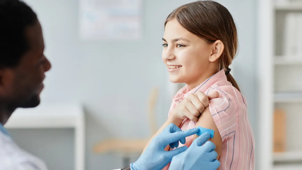 Child receiving a vaccine from a pediatrician at a clinic in Katy, TX, highlighting childhood immunizations and pediatric care